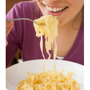 woman eating pasta