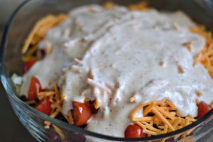 salad covered in dressing 