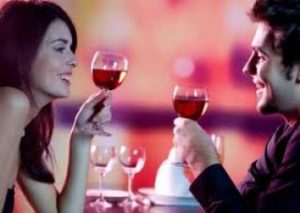 woman and man with red wine
