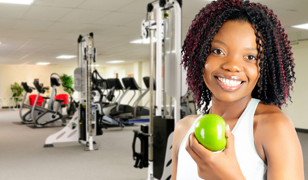 African American Young Woman Enjoying A Healthy Snack At The Gym