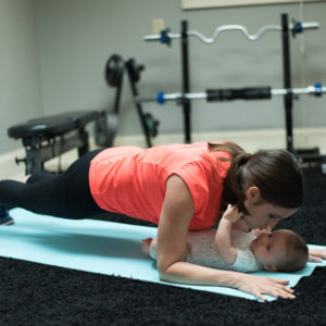 Erika Volk doing planks with her son