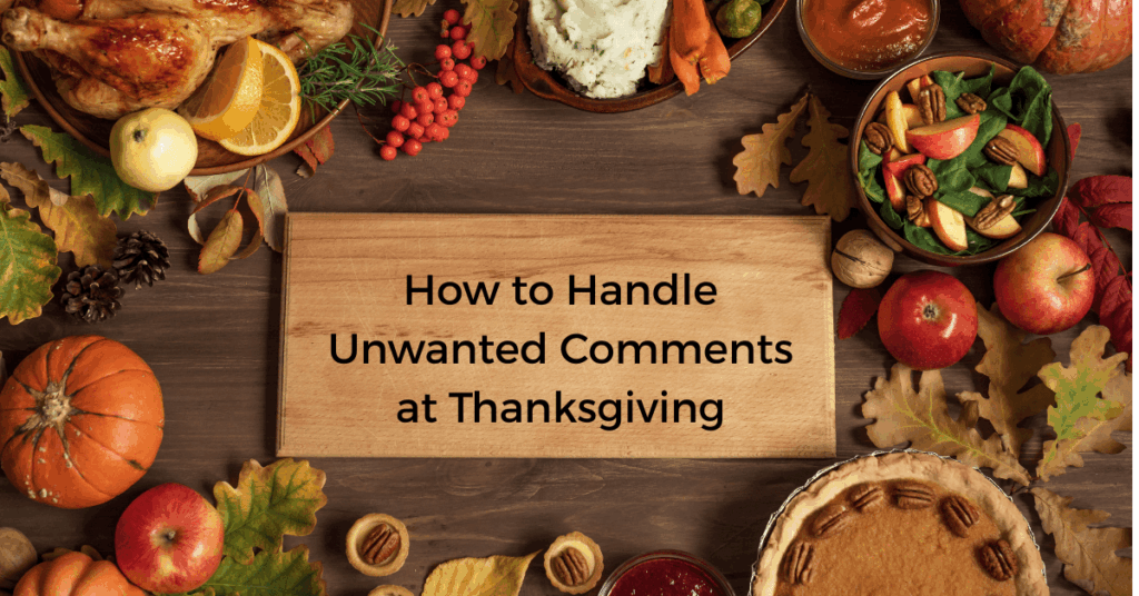 Thanksgiving table with traditional holiday foods and a wooden sign displaying How to Handle Unwanted Comments at Thanksgiving.