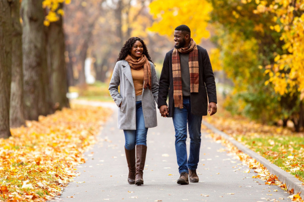 Couple walking outdoors in autumn, symbolizing balance, freedom, and confidence while transitioning off GLP-1 medication.