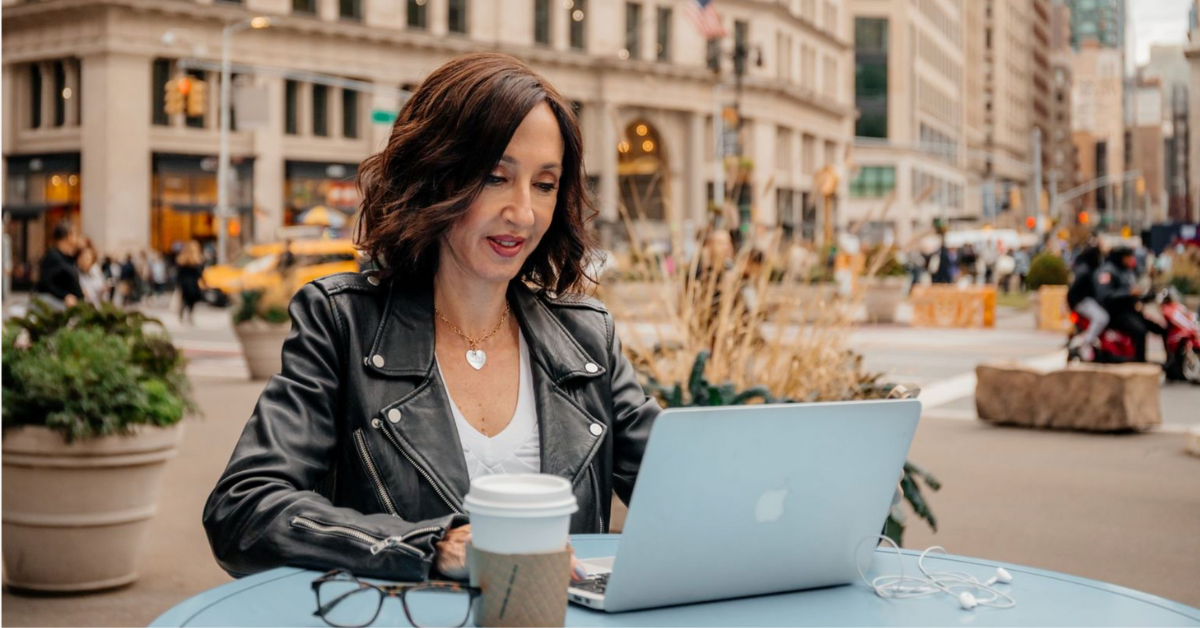 Registered Dietitian Martha McKittrick working on a laptop in NYC, specializing in GLP-1 weight loss and metabolic health support.